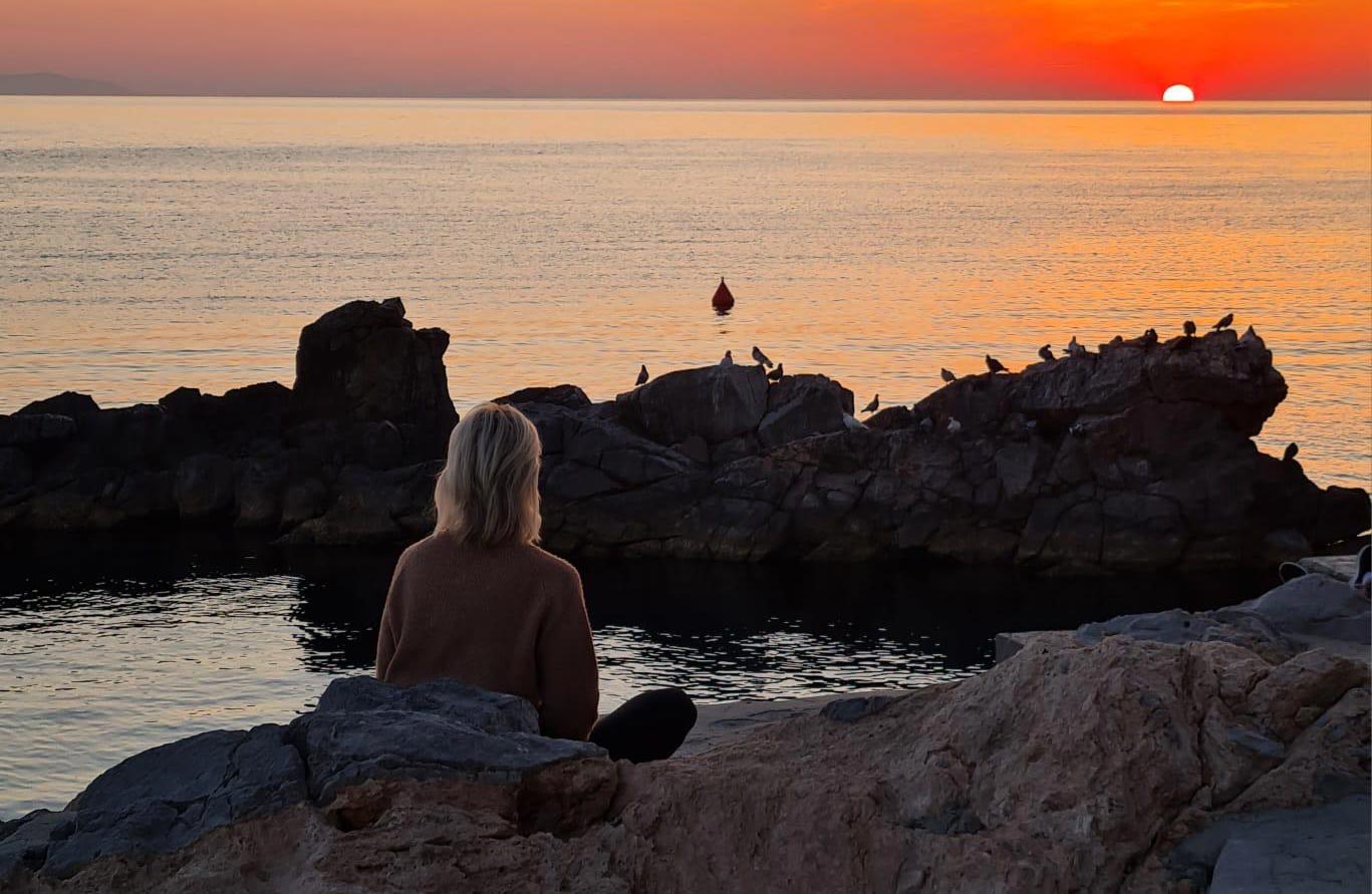 Person watching sunset in Greece