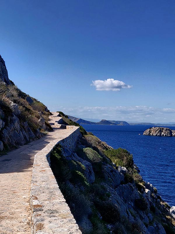 Beautiful roadway on the edge of a seaside cliff, in Greece